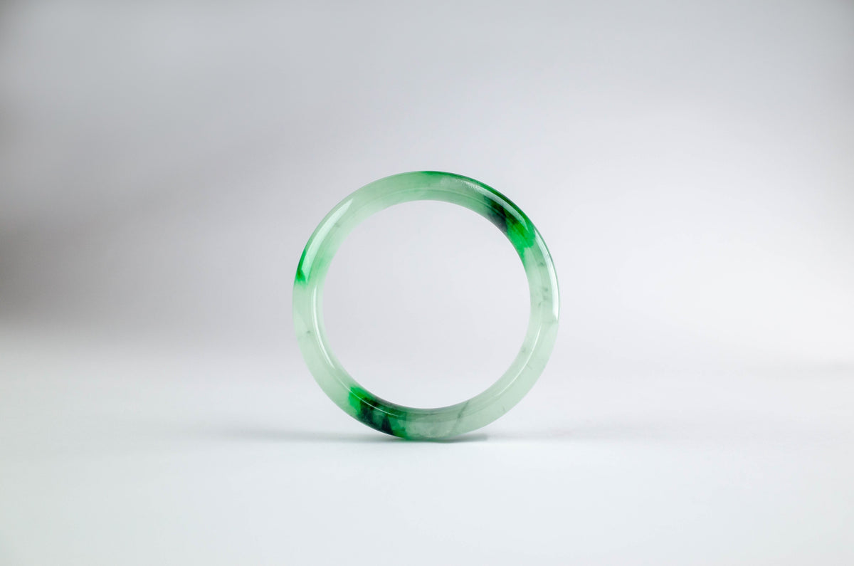 Natural green and white jadeite bangle representing the long history of jade